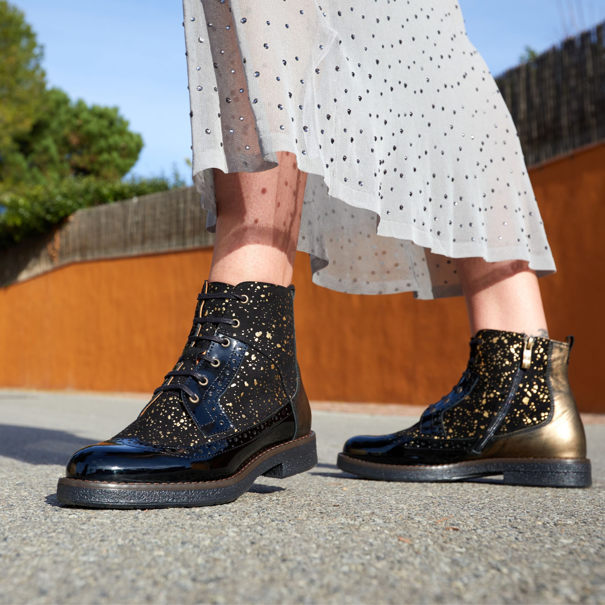 Hatter - Gold Drops - Women's ankle boot in golden paint drops on black leather